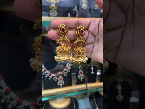 Beautiful jumkhas with peacock design and nakshi polish